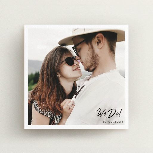 A personalised wedding invitation design titled "Script Corner". It is a square (148mm x 148mm) invite in a square orientation. It is a photographic personalised wedding invitation with room for 1 photo. "Script Corner" is available as a flat invite, with mainly white colouring.
