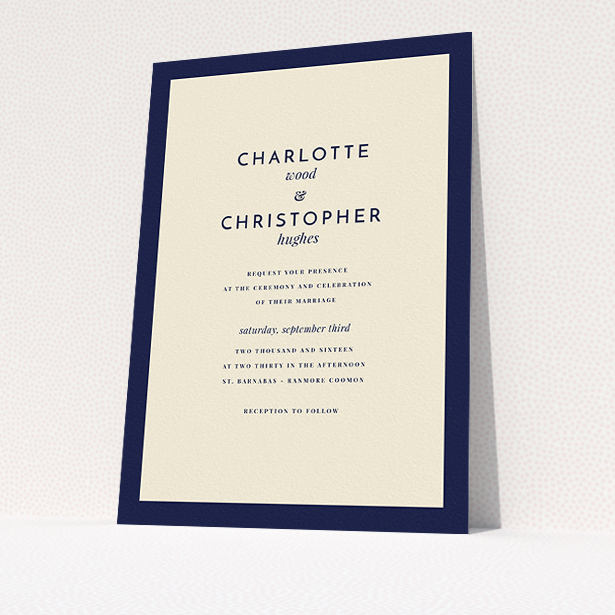 A personalised wedding invitation called "Script switch". It is an A5 invite in a portrait orientation. "Script switch" is available as a flat invite, with tones of cream and navy blue.