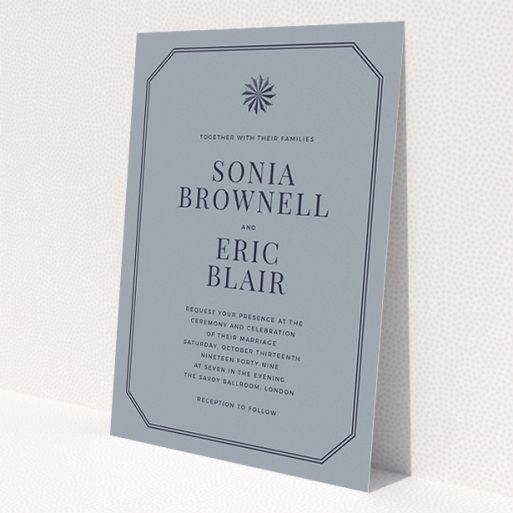 A personalised wedding invitation called 'Shaded sundial'. It is an A5 invite in a portrait orientation. 'Shaded sundial' is available as a flat invite, with tones of dark grey and navy blue.
