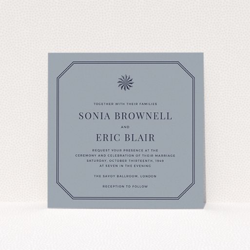 A personalised wedding invitation design called "Shaded sundial". It is a square (148mm x 148mm) invite in a square orientation. "Shaded sundial" is available as a flat invite, with tones of dark grey and navy blue.