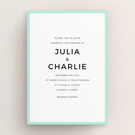A personalised wedding invitation design named "Slight Frame". It is an A5 invite in a portrait orientation. "Slight Frame" is available as a flat invite, with tones of green and white.