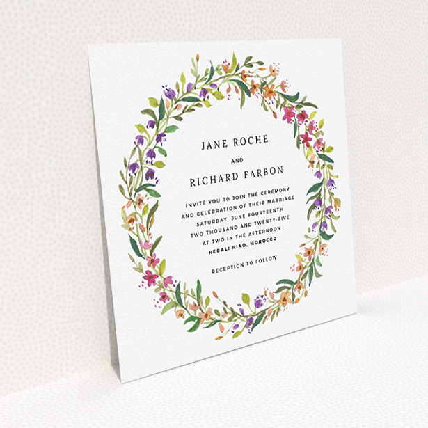 A personalised wedding invitation named "Spring Florist". It is a square (148mm x 148mm) invite in a square orientation. "Spring Florist" is available as a flat invite, with tones of light green and orange.