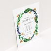 A personalised wedding invitation named "Summer Whirl Wreath". It is an A5 invite in a portrait orientation. "Summer Whirl Wreath" is available as a flat invite, with tones of green, dark blue and orange.