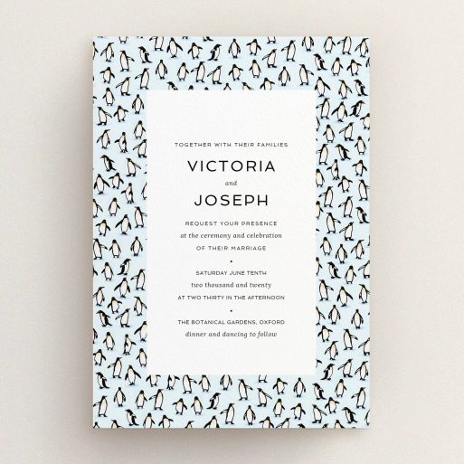 A personalised wedding invitation called "Tiny, Tiny Penguins". It is an A5 invite in a portrait orientation. "Tiny, Tiny Penguins" is available as a flat invite, with tones of blue and white.