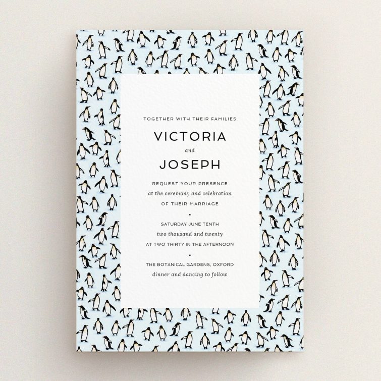 A personalised wedding invitation called "Tiny, Tiny Penguins". It is an A5 invite in a portrait orientation. "Tiny, Tiny Penguins" is available as a flat invite, with tones of blue and white.
