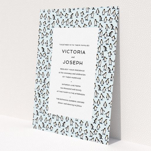 A personalised wedding invitation called 'Tiny, Tiny Penguins'. It is an A5 invite in a portrait orientation. 'Tiny, Tiny Penguins' is available as a flat invite, with tones of blue and white.