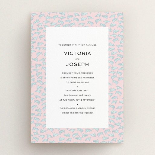 A personalised wedding invitation design named "Tiny, Tiny Turtles". It is an A5 invite in a portrait orientation. "Tiny, Tiny Turtles" is available as a flat invite, with tones of blue and pink.