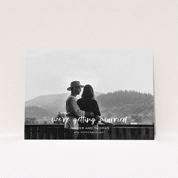 A personalised wedding invitation design titled "To the Point". It is an A6 invite in a landscape orientation. It is a photographic personalised wedding invitation with room for 1 photo. "To the Point" is available as a flat invite, with mainly white colouring.