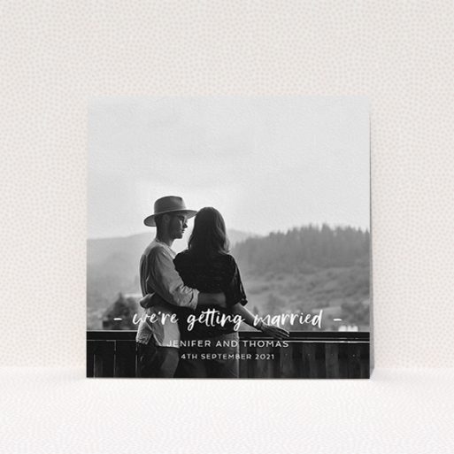 A personalised wedding invitation named "To the Point". It is a square (148mm x 148mm) invite in a square orientation. It is a photographic personalised wedding invitation with room for 1 photo. "To the Point" is available as a flat invite, with mainly white colouring.