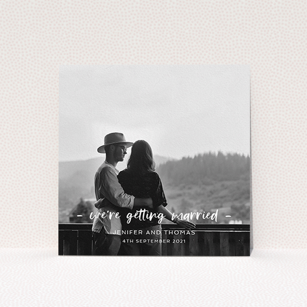 A personalised wedding invitation named "To the Point". It is a square (148mm x 148mm) invite in a square orientation. It is a photographic personalised wedding invitation with room for 1 photo. "To the Point" is available as a flat invite, with mainly white colouring.