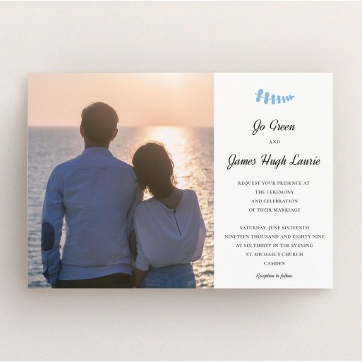 A personalised wedding invitation called "Us and blossom". It is an A5 invite in a landscape orientation. It is a photographic personalised wedding invitation with room for 1 photo. "Us and blossom" is available as a flat invite, with tones of white and blue.