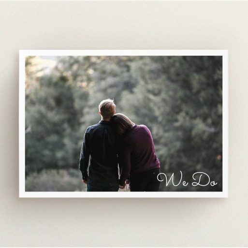 A personalised wedding invitation called "We Do Photo". It is an A5 invite in a landscape orientation. It is a photographic personalised wedding invitation with room for 1 photo. "We Do Photo" is available as a flat invite, with mainly white colouring.