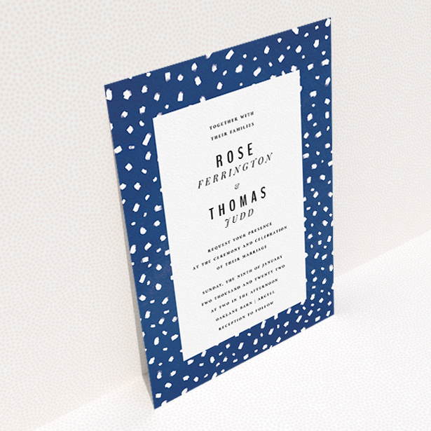 A personalised wedding invitation design called "White dots". It is an A5 invite in a portrait orientation. "White dots" is available as a flat invite, with tones of blue and white.
