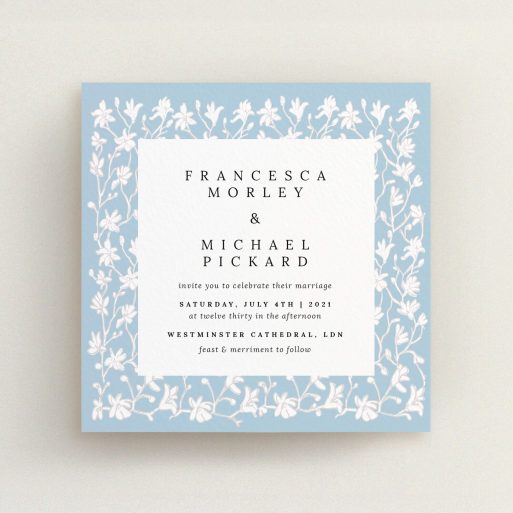 A personalised wedding invitation design named "White Ivy". It is a square (148mm x 148mm) invite in a square orientation. "White Ivy" is available as a flat invite, with tones of blue and white.