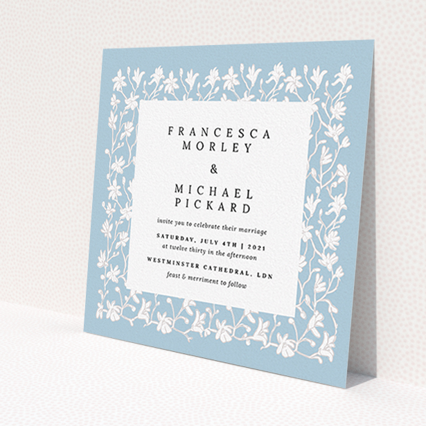 A personalised wedding invitation design named "White Ivy". It is a square (148mm x 148mm) invite in a square orientation. "White Ivy" is available as a flat invite, with tones of blue and white.