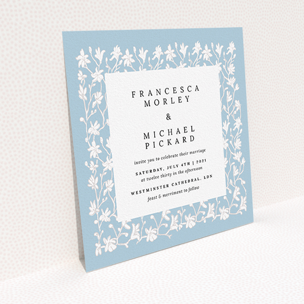 A personalised wedding invitation design named "White Ivy". It is a square (148mm x 148mm) invite in a square orientation. "White Ivy" is available as a flat invite, with tones of blue and white.