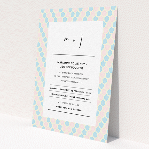 A personalised wedding invitation named "Worn Tiles". It is an A5 invite in a portrait orientation. "Worn Tiles" is available as a flat invite, with tones of pink, blue and cream.