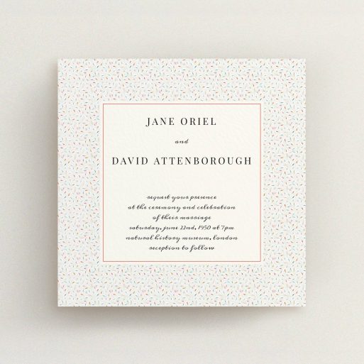 A personalised wedding invite named "A hint of confetti". It is a square (148mm x 148mm) invite in a square orientation. "A hint of confetti" is available as a flat invite, with tones of cream and red.