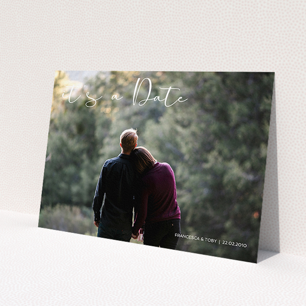 A personalised wedding invite named "Koh Tao". It is an A5 invite in a landscape orientation. It is a photographic personalised wedding invite with room for 1 photo. "Koh Tao" is available as a flat invite, with mainly white colouring.