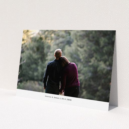 A personalised wedding invite design named 'Landscape Photo'. It is an A5 invite in a landscape orientation. It is a photographic personalised wedding invite with room for 1 photo. 'Landscape Photo' is available as a flat invite, with mainly white colouring.