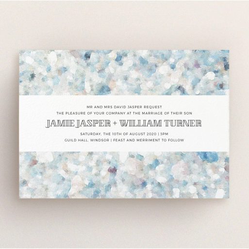 A personalised wedding invite named "Speckled Oils". It is an A5 invite in a landscape orientation. "Speckled Oils" is available as a flat invite, with tones of light blue, light grey and white.