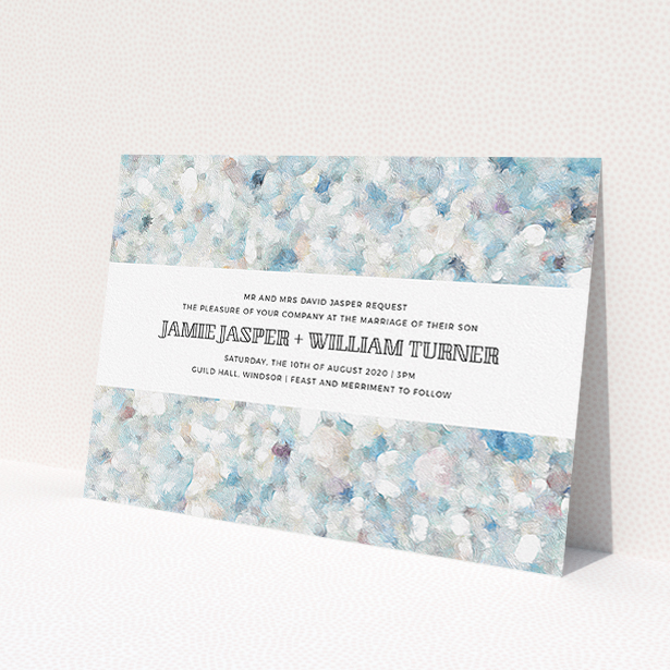 A personalised wedding invite named "Speckled Oils". It is an A5 invite in a landscape orientation. "Speckled Oils" is available as a flat invite, with tones of light blue, light grey and white.
