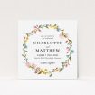 A personalised wedding invite template titled "Spring Wreath". It is a square (148mm x 148mm) invite in a square orientation. "Spring Wreath" is available as a flat invite, with mainly pink colouring.