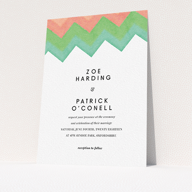 A personalised wedding invite named "Vibrant Peaks". It is an A6 invite in a portrait orientation. "Vibrant Peaks" is available as a flat invite, with tones of white, orange and green.