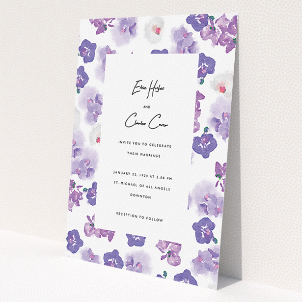 A personalised wedding invite template titled "Violet Explosion". It is an A5 invite in a portrait orientation. "Violet Explosion" is available as a flat invite, with tones of white, purple and violet.