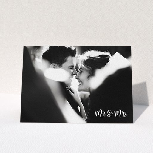 A photo wedding thank you card template titled "Black and White". It is an A6 card in a landscape orientation. It is a photographic photo wedding thank you card with room for 1 photo. "Black and White" is available as a folded card, with mainly white colouring.