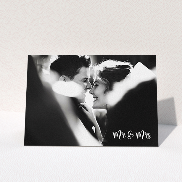 A photo wedding thank you card template titled "Black and White". It is an A6 card in a landscape orientation. It is a photographic photo wedding thank you card with room for 1 photo. "Black and White" is available as a folded card, with mainly white colouring.