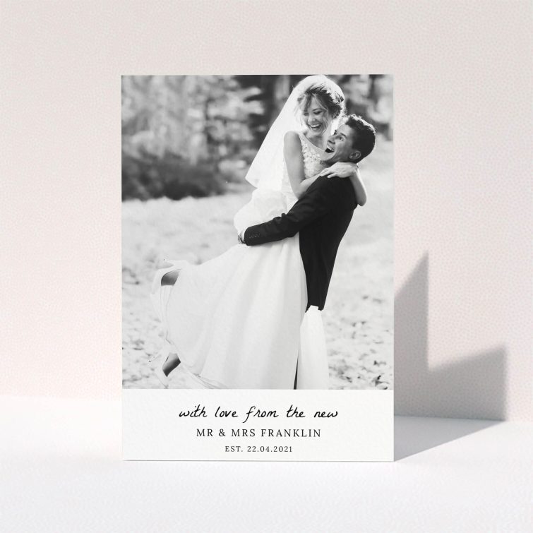 A photo wedding thank you card design named "Black and White Thanks". It is an A5 card in a portrait orientation. It is a photographic photo wedding thank you card with room for 1 photo. "Black and White Thanks" is available as a folded card, with mainly white colouring.