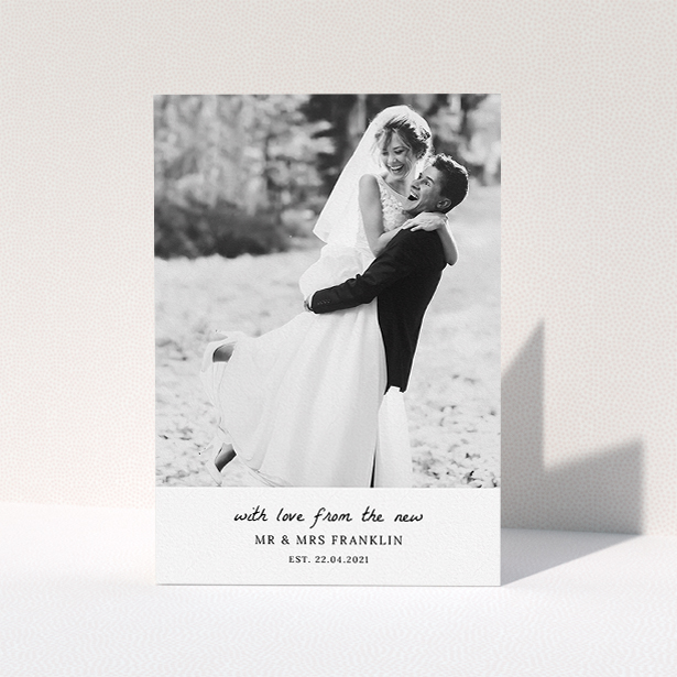 A photo wedding thank you card design named "Black and White Thanks". It is an A5 card in a portrait orientation. It is a photographic photo wedding thank you card with room for 1 photo. "Black and White Thanks" is available as a folded card, with mainly white colouring.