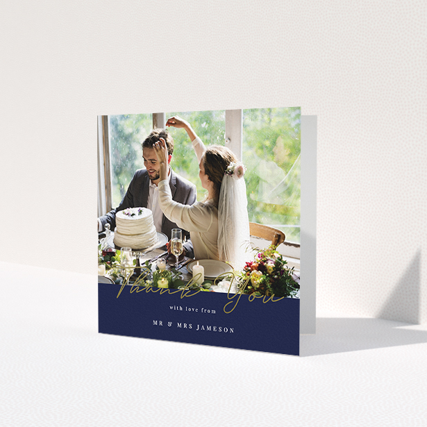 A photo wedding thank you card called 'Blue and Gold'. It is a square (148mm x 148mm) card in a square orientation. It is a photographic photo wedding thank you card with room for 1 photo. 'Blue and Gold' is available as a folded card, with tones of navy blue and white.