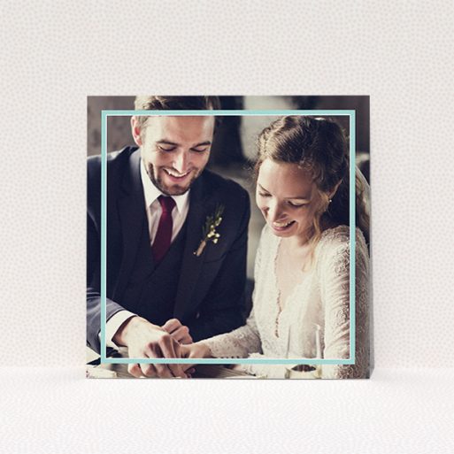 A photo wedding thank you card design titled "Blue White Photo Frame". It is a square (148mm x 148mm) card in a square orientation. It is a photographic photo wedding thank you card with room for 1 photo. "Blue White Photo Frame" is available as a flat card, with mainly blue colouring.