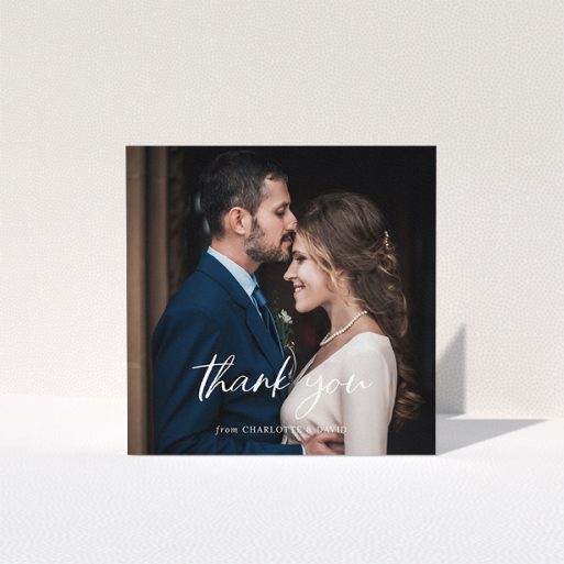 A photo wedding thank you card named "Calligraphy Thanks". It is a square (148mm x 148mm) card in a square orientation. It is a photographic photo wedding thank you card with room for 1 photo. "Calligraphy Thanks" is available as a folded card, with mainly white colouring.
