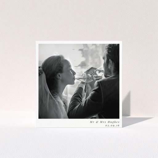 A photo wedding thank you card design named "Clean and simple". It is a square (148mm x 148mm) card in a square orientation. It is a photographic photo wedding thank you card with room for 1 photo. "Clean and simple" is available as a folded card, with mainly white colouring.
