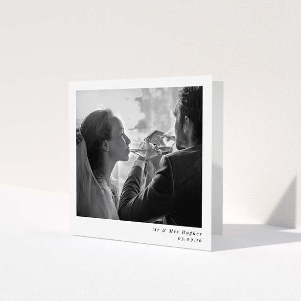 A photo wedding thank you card design named 'Clean and simple'. It is a square (148mm x 148mm) card in a square orientation. It is a photographic photo wedding thank you card with room for 1 photo. 'Clean and simple' is available as a folded card, with mainly white colouring.