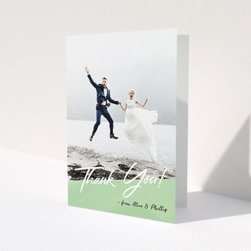A photo wedding thank you card design called 'Green Slant Thank You'. It is an A6 card in a portrait orientation. It is a photographic photo wedding thank you card with room for 1 photo. 'Green Slant Thank You' is available as a folded card, with tones of green and white.