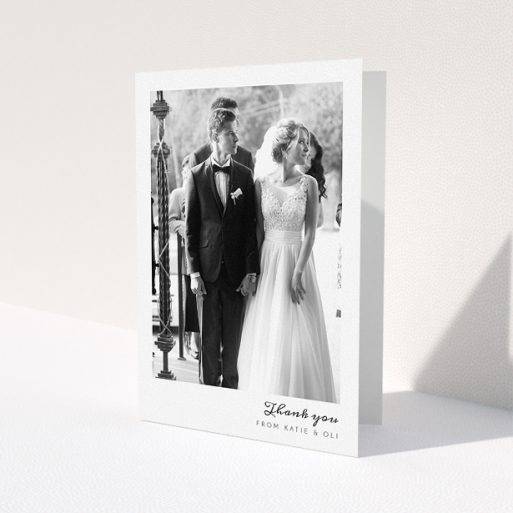 A photo wedding thank you card design titled 'Handwritten script'. It is an A5 card in a portrait orientation. It is a photographic photo wedding thank you card with room for 1 photo. 'Handwritten script' is available as a folded card, with mainly white colouring.