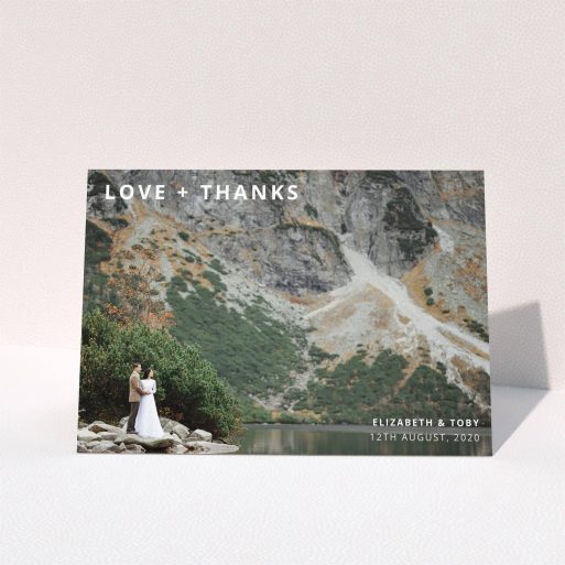 A photo wedding thank you card design titled "Love and Thanks Landscape". It is an A5 card in a landscape orientation. It is a photographic photo wedding thank you card with room for 1 photo. "Love and Thanks Landscape" is available as a folded card, with mainly white colouring.