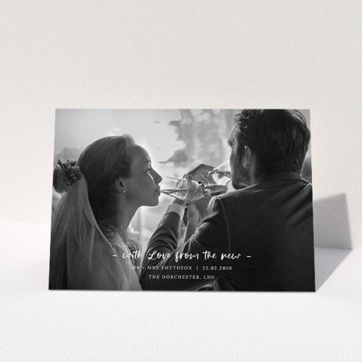 A photo wedding thank you card design named "Modern Wedding Photography". It is an A5 card in a landscape orientation. It is a photographic photo wedding thank you card with room for 1 photo. "Modern Wedding Photography" is available as a folded card, with mainly white colouring.
