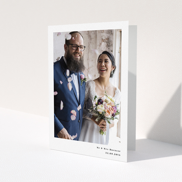 A photo wedding thank you card called "Most of the page". It is an A5 card in a portrait orientation. It is a photographic photo wedding thank you card with room for 1 photo. "Most of the page" is available as a folded card, with mainly white colouring.