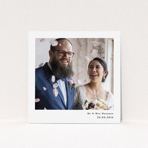 A photo wedding thank you card called "Most of the page". It is a square (148mm x 148mm) card in a square orientation. It is a photographic photo wedding thank you card with room for 1 photo. "Most of the page" is available as a flat card, with mainly white colouring.