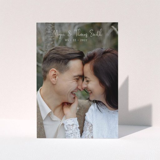 A photo wedding thank you card template titled "Name-Date-Photo". It is an A5 card in a portrait orientation. It is a photographic photo wedding thank you card with room for 1 photo. "Name-Date-Photo" is available as a folded card, with mainly white colouring.