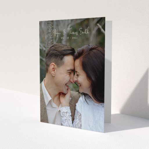 A photo wedding thank you card template titled 'Name-Date-Photo'. It is an A5 card in a portrait orientation. It is a photographic photo wedding thank you card with room for 1 photo. 'Name-Date-Photo' is available as a folded card, with mainly white colouring.