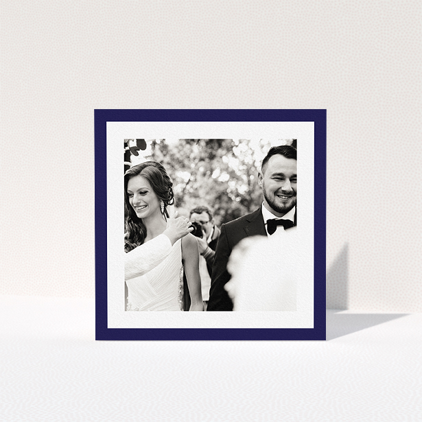 A photo wedding thank you card design named "Navy Border". It is a square (148mm x 148mm) card in a square orientation. It is a photographic photo wedding thank you card with room for 1 photo. "Navy Border" is available as a folded card, with tones of blue and white.