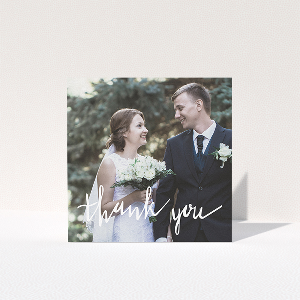 A photo wedding thank you card design called "New to calligraphy". It is a square (148mm x 148mm) card in a square orientation. It is a photographic photo wedding thank you card with room for 1 photo. "New to calligraphy" is available as a folded card, with mainly white colouring.