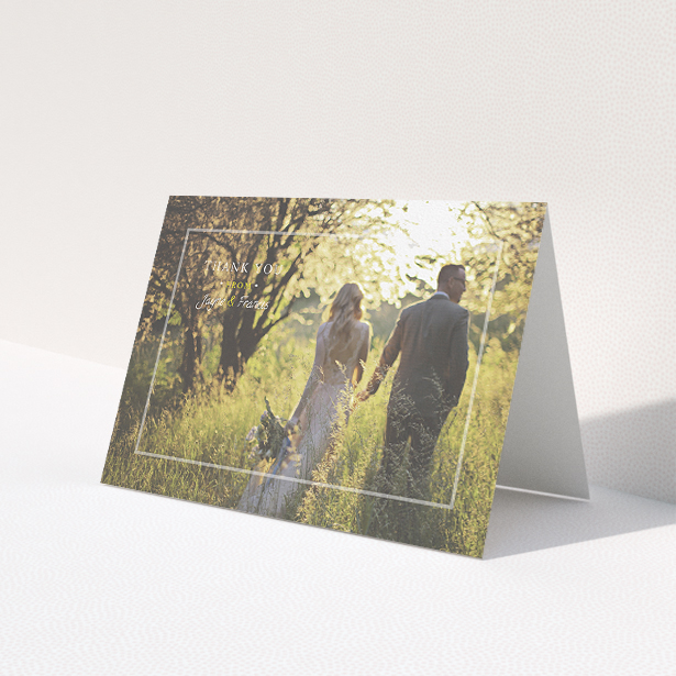 A photo wedding thank you card called 'Not even there'. It is an A5 card in a landscape orientation. It is a photographic photo wedding thank you card with room for 1 photo. 'Not even there' is available as a folded card, with mainly white colouring.