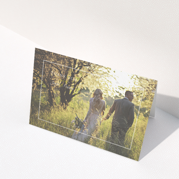 A photo wedding thank you card called "Not even there". It is an A5 card in a landscape orientation. It is a photographic photo wedding thank you card with room for 1 photo. "Not even there" is available as a folded card, with mainly white colouring.